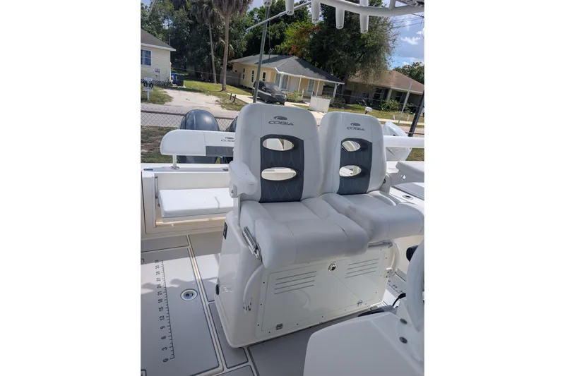 Slide: The Image of 2020 Cobia 262 Center Console boat interior with dual seats and storage. - 11