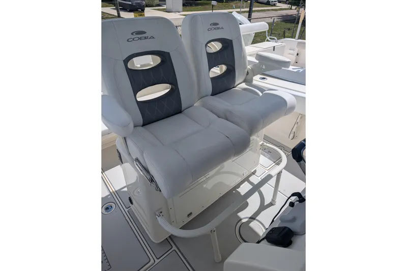 Slide: The Image of 2020 Cobia 262 Center Console boat seats, featuring cushioned dual seating. - 12