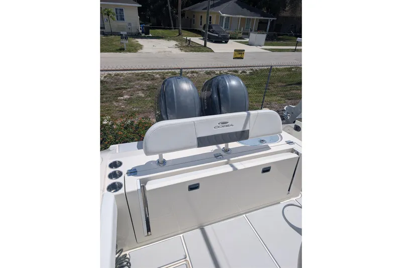 Slide: The Image of 2020 Cobia 262 Center Console boat with dual engines and sleek design. - 13