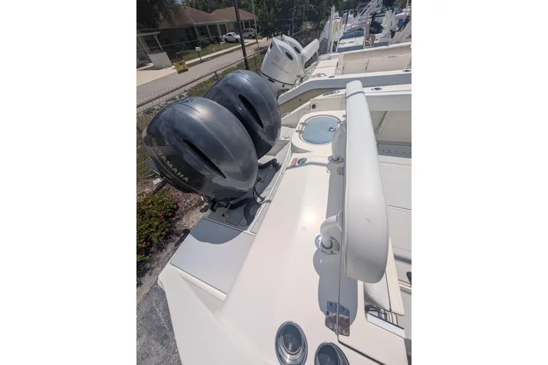 Slide: The Image of 2020 Cobia 262 Center Console boat with dual Yamaha outboard engines. - 19