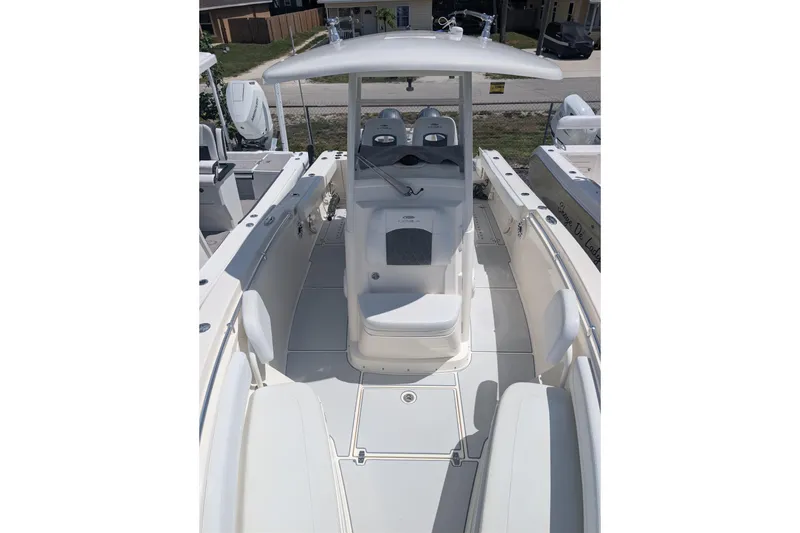 Slide: The Image of 2020 Cobia 262 Center Console boat with spacious deck and seating area. - 8
