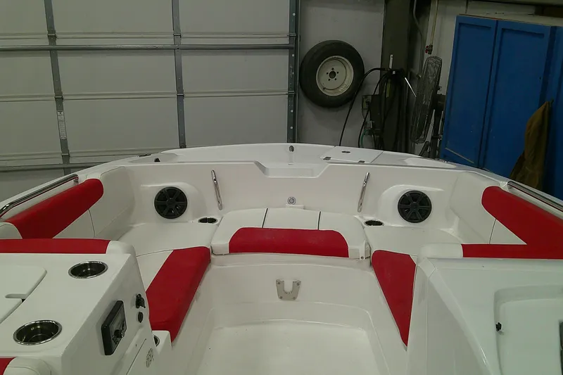 Slide: The Image of Interior of a 2026 Tahoe 2150 boat with red and white seating. - 1