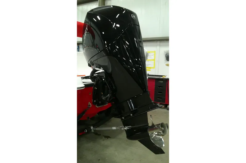 Slide: The Image of 2026 Tahoe 2150 boat engine in a workshop setting. - 4