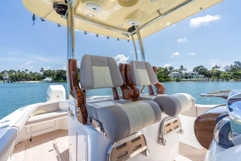 Slide: The Image of 2020 Mag Bay 33 CC boat interior with luxury seating and ocean view. - 36