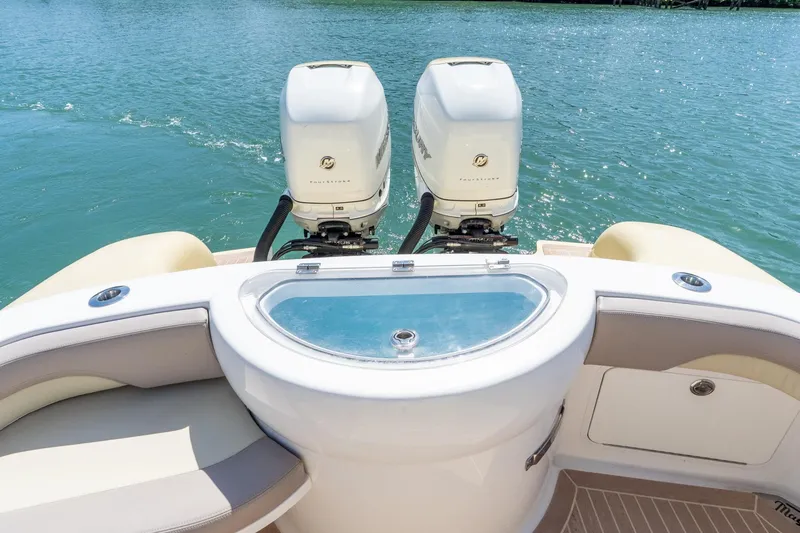 Slide: The Image of 2020 Mag Bay 33 CC boat with twin outboard engines on a sunny day. - 38