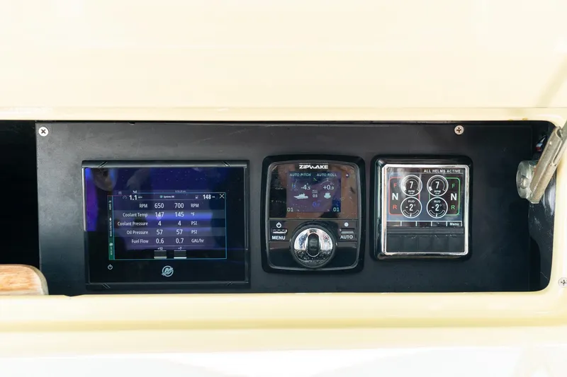 Slide: The Image of Dashboard of 2020 Mag Bay 33 CC boat with digital displays and controls. - 39