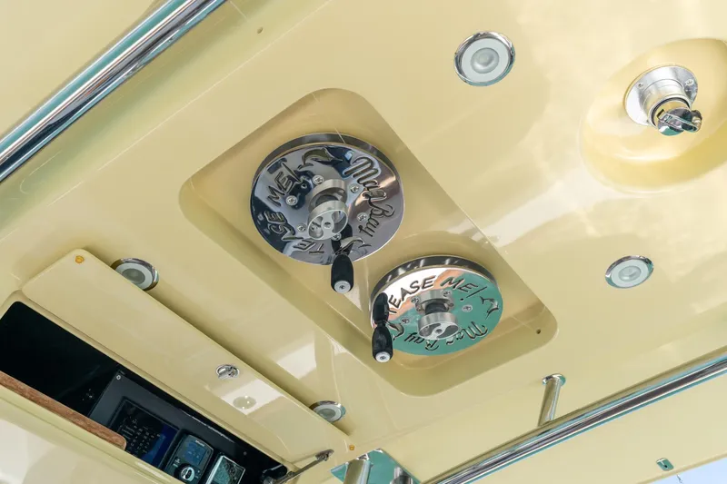 Slide: The Image of 2020 Mag Bay 33 CC boat ceiling with mounted equipment and controls. - 40
