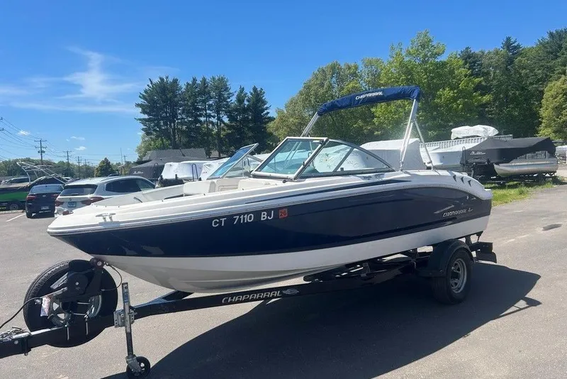Slide: The Image of 2017 Chaparral 19 H2O Sport boat on trailer in sunny parking lot. - 5