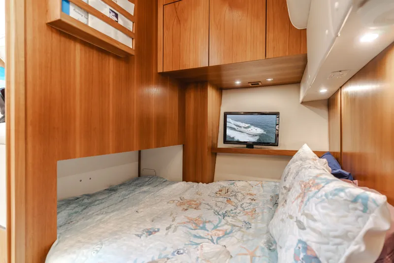 Slide: The Image of Interior of 2004 Tiara Yachts 4000 with cozy bed and TV. - 39