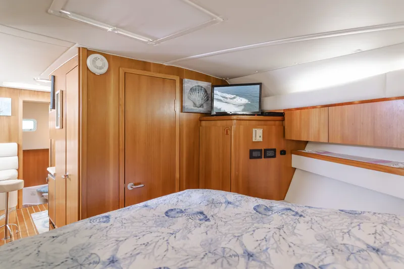 Slide: The Image of Interior of a 2004 Tiara Yachts 4000 with wooden furnishings. - 44