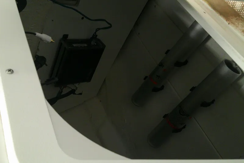 Slide: The Image of Interior view of a 2026 Tahoe 2150 CC boat compartment with wiring and mounted tubes. - 10