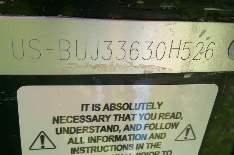 Slide: The Image of VIN plate on 2026 Tahoe 2150 CC with safety instructions label. - 13