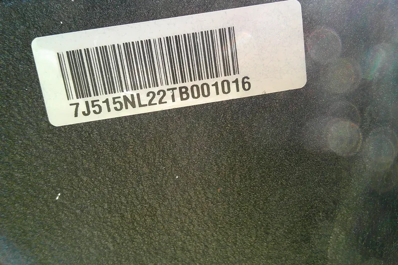 Slide: The Image of Barcode label on 2026 Tahoe 2150 CC boat surface, displaying serial number. - 15