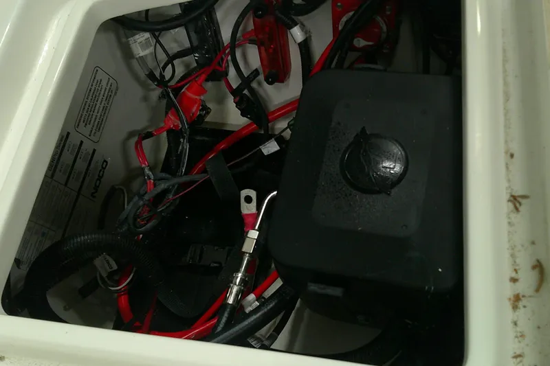 Slide: The Image of Electrical compartment of 2026 Tahoe 2150 CC boat with wiring and battery box. - 9
