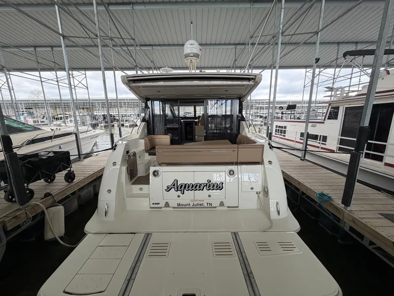Slide: The Image of 2017 Sea Ray Sundancer 400 yacht docked, rear view. - 2