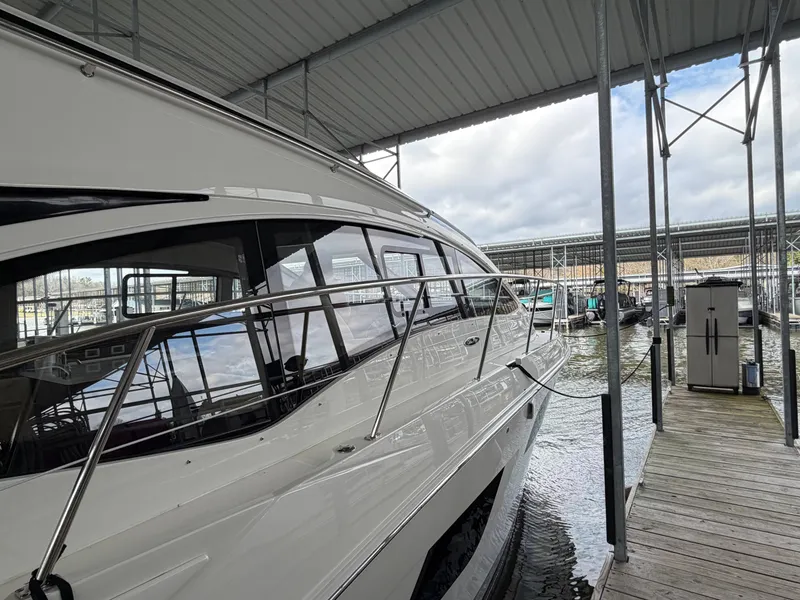 Slide: The Image of 2017 Sea Ray Sundancer 400 docked in a covered marina. - 22