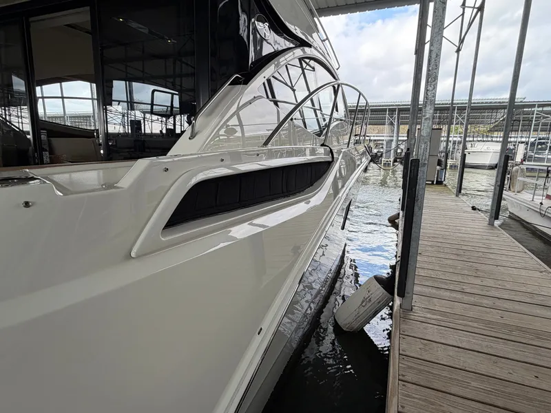 Slide: The Image of 2017 Sea Ray Sundancer 400 yacht docked at marina. - 24
