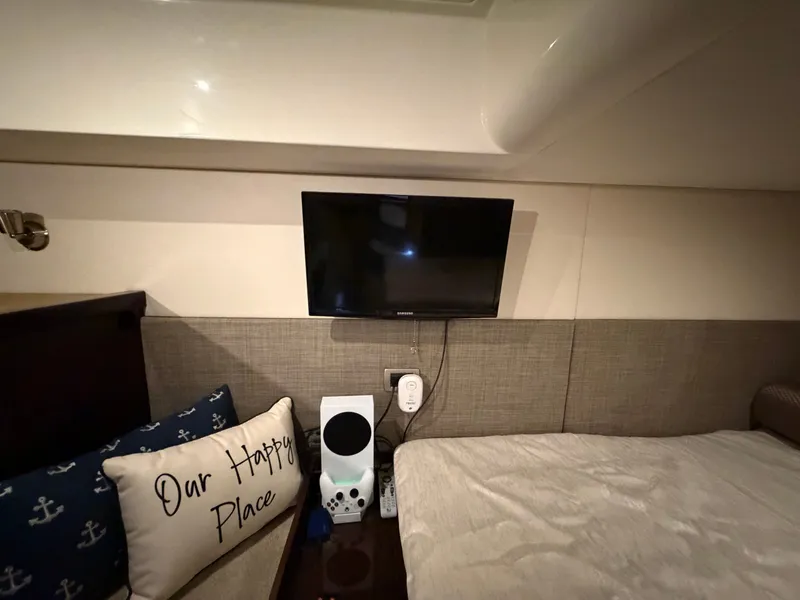 Slide: The Image of Interior of Sea Ray Sundancer 400 yacht, cozy bedroom with TV. - 31