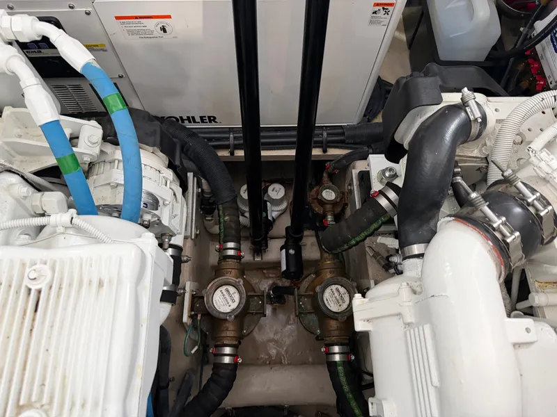 Slide: The Image of Engine room of 2017 Sea Ray Sundancer 400 with hoses and valves. - 43