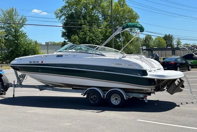 The Image of 2006 Four Winns 244 Funship boat on trailer in parking lot. - 0