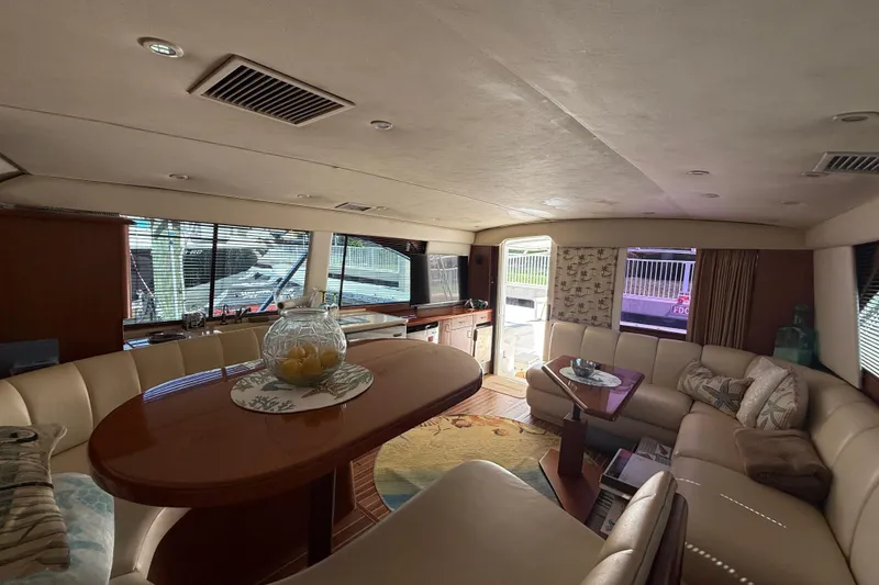 Slide: The Image of Luxurious interior of a 1997 Ocean Yachts 40 Super Sport, featuring elegant seating and decor. - 10