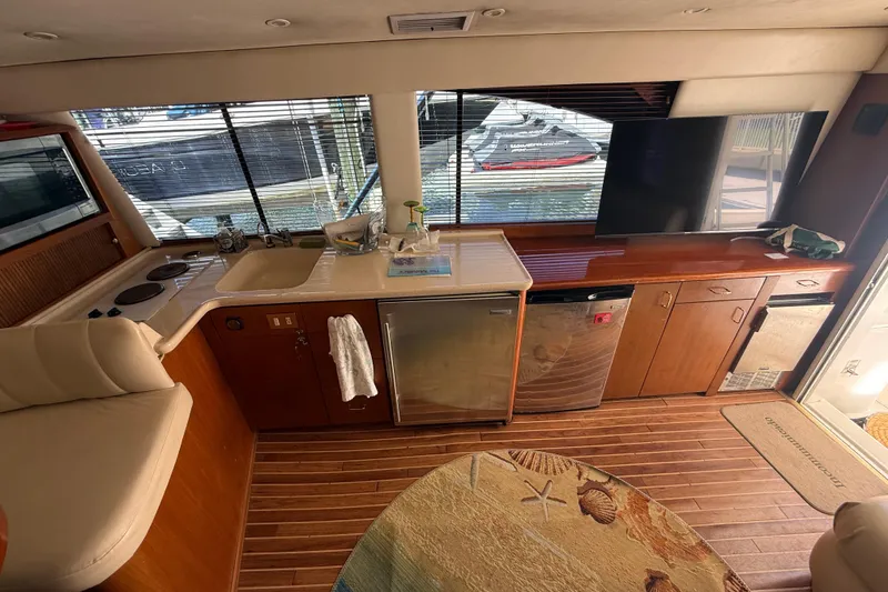 Slide: The Image of Interior of a 1997 Ocean Yachts 40 Super Sport with kitchen and seating area. - 11