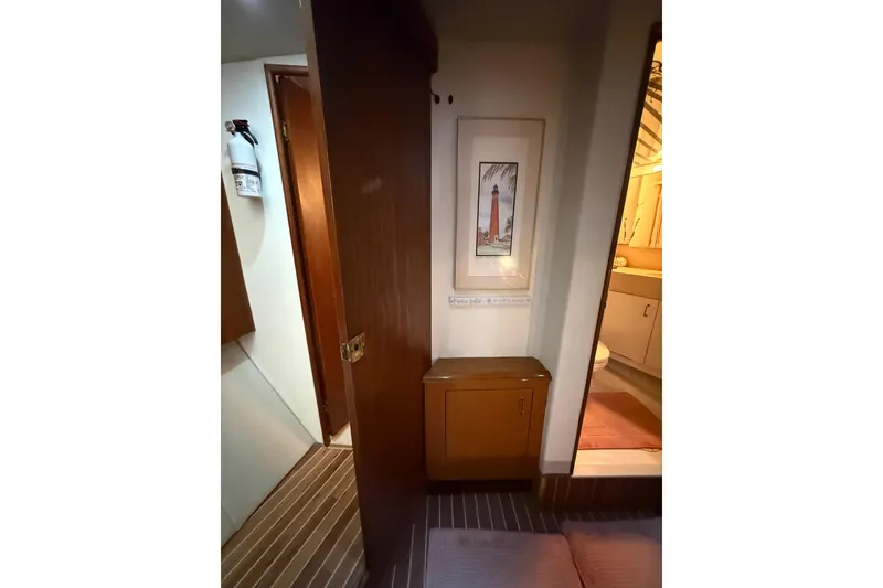 Slide: The Image of Interior of 1997 Ocean Yachts 40 Super Sport with wooden cabinetry and nautical decor. - 16