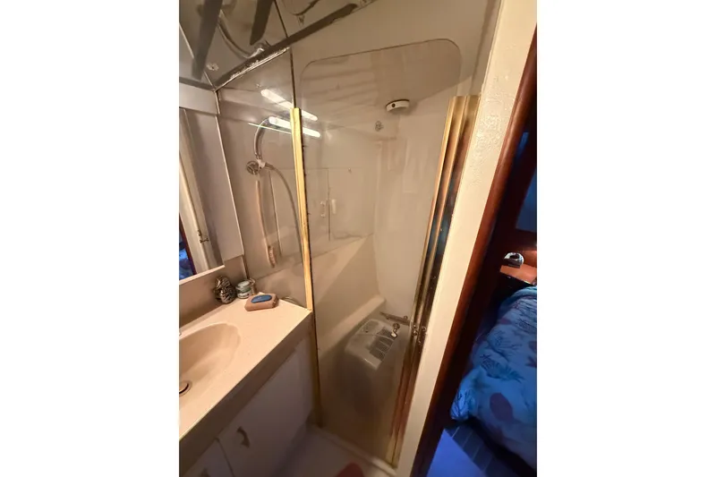 Slide: The Image of Bathroom interior of 1997 Ocean Yachts 40 Super Sport with shower and sink. - 18