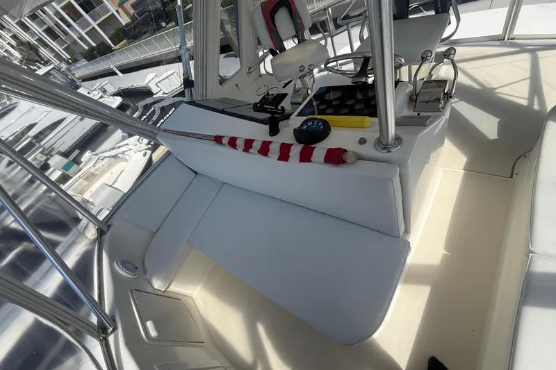 Slide: The Image of Cockpit of 1997 Ocean Yachts 40 Super Sport with helm controls and seating. - 23