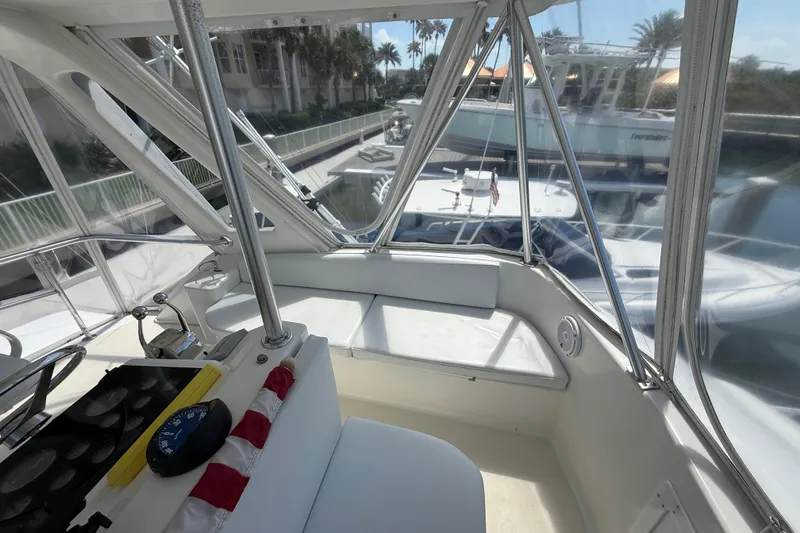 Slide: The Image of Interior view of 1997 Ocean Yachts 40 Super Sport, showcasing helm and seating area. - 24