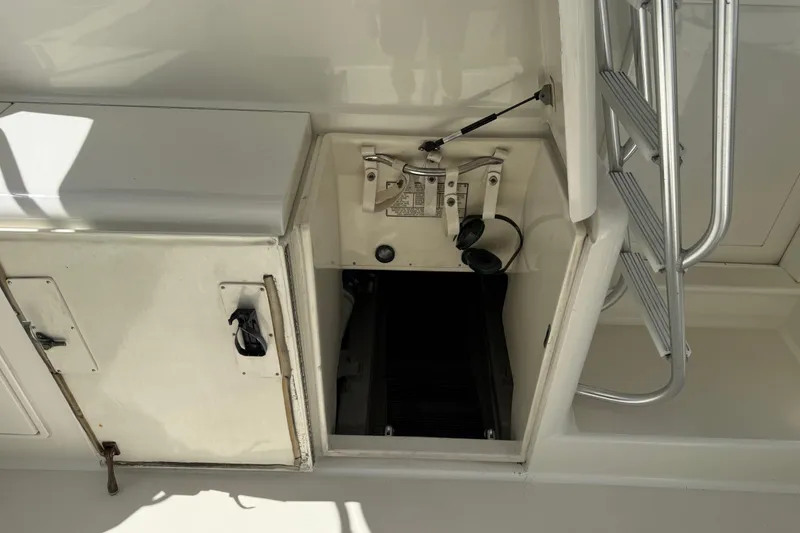 Slide: The Image of Engine compartment of a 1997 Ocean Yachts 40 Super Sport with ladder access. - 27