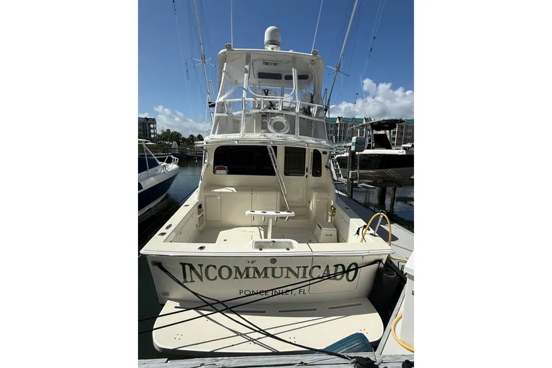 Slide: The Image of 1997 Ocean Yachts 40 Super Sport docked, rear view with tower and fishing equipment. - 3