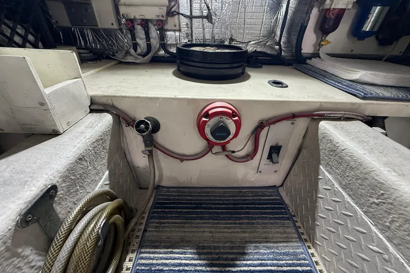 Slide: The Image of Engine room of a 1997 Ocean Yachts 40 Super Sport with wiring and equipment. - 32