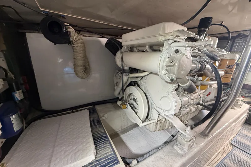 Slide: The Image of Engine room of a 1997 Ocean Yachts 40 Super Sport, showcasing marine engine components. - 33
