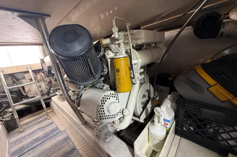 Slide: The Image of Engine room of a 1997 Ocean Yachts 40 Super Sport, showcasing mechanical components. - 34