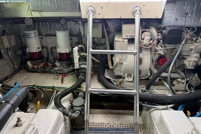Slide: The Image of Engine room of a 1997 Ocean Yachts 40 Super Sport with visible machinery and equipment. - 35