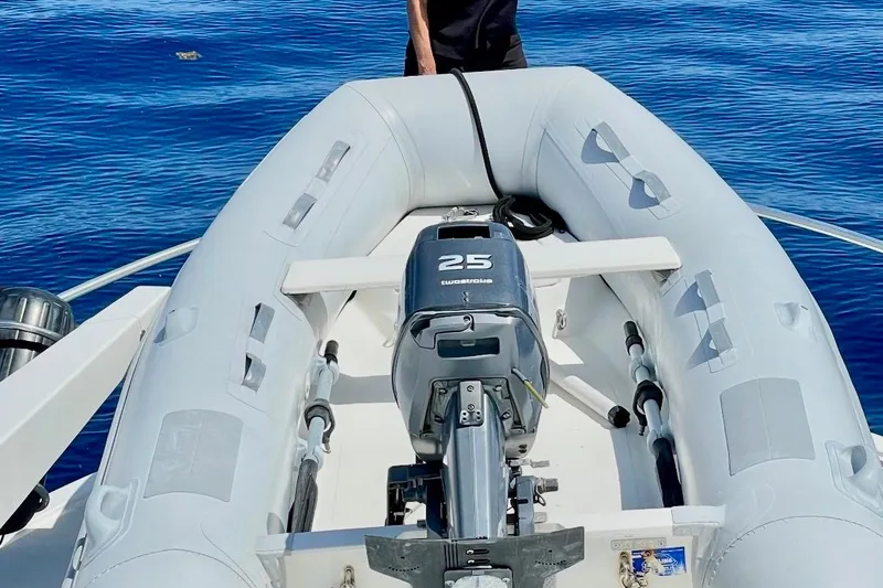 Slide: The Image of Inflatable boat with 25 horsepower motor on Ocean Yachts 40 Super Sport, 1997 model. - 37