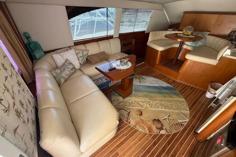 Slide: The Image of Luxurious 1997 Ocean Yachts 40 Super Sport interior with plush seating and nautical decor. - 7