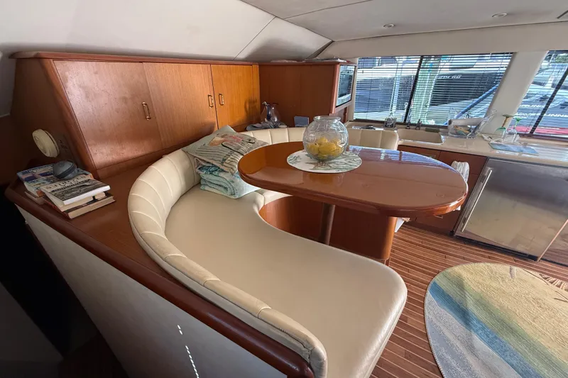 Slide: The Image of Luxurious interior of a 1997 Ocean Yachts 40 Super Sport with elegant seating and dining area. - 9