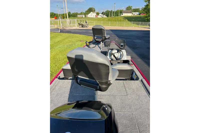 Slide: The Image of 2026 Tracker Bass Tracker Classic XL boat interior with steering wheel and seating. - 7