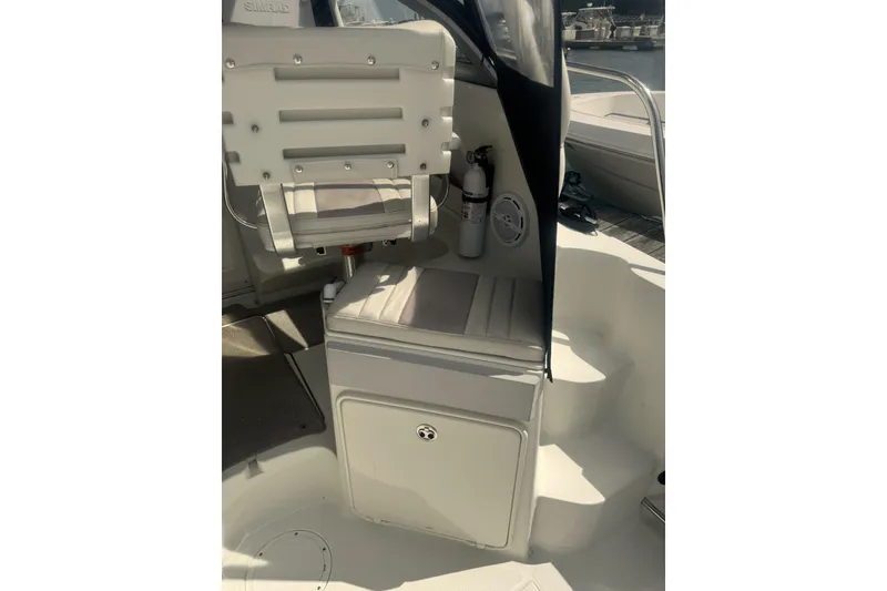 Slide: The Image of 2007 Sailfish 2660 WAC boat interior with seating and storage. - 10