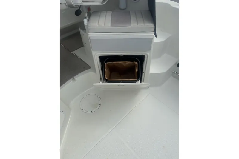 Slide: The Image of 2007 Sailfish 2660 WAC boat interior with open storage compartment. - 11