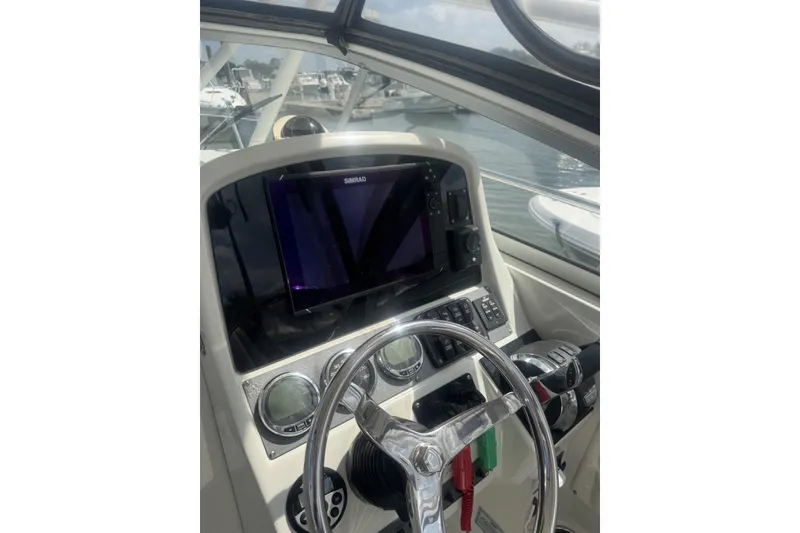 Slide: The Image of Helm of 2007 Sailfish 2660 WAC boat with Simrad navigation system. - 13