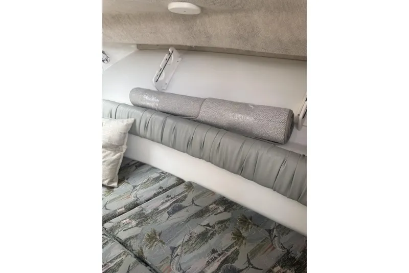 Slide: The Image of Interior cabin of 2007 Sailfish 2660 WAC boat with cushions and rolled mat. - 17