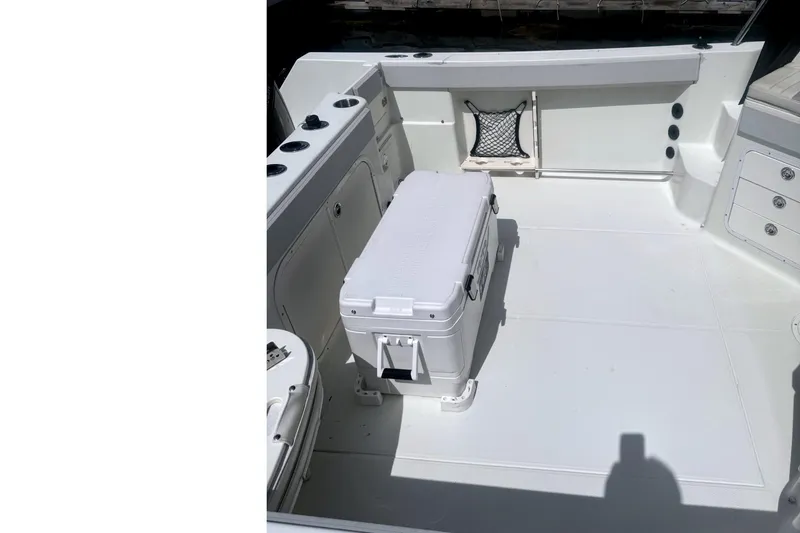 Slide: The Image of 2007 Sailfish 2660 WAC boat deck with cooler and storage compartments. - 6