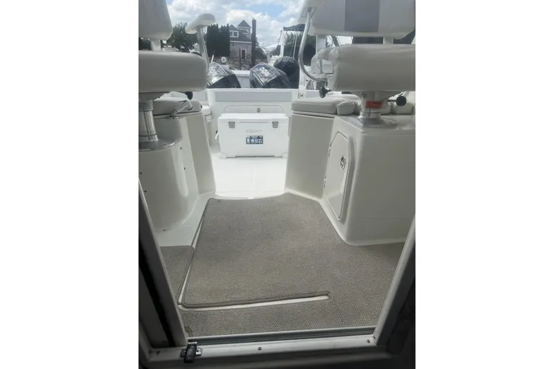 Slide: The Image of 2007 Sailfish 2660 WAC boat interior with seating and storage compartments. - 9
