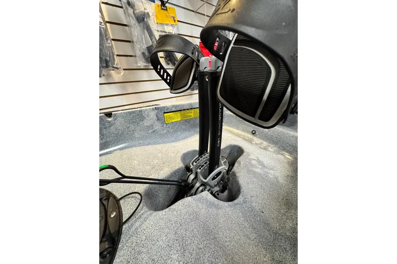 Slide: The Image of 2024 Hobie Mirage Compass pedal drive system in a kayak showroom. - 3