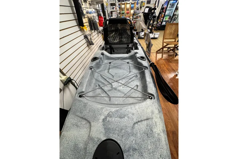 Slide: The Image of 2024 Hobie Mirage Compass kayak displayed in a store setting. - 4