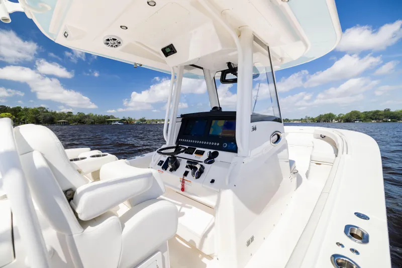 Slide: The Image of 2024 Regulator 34 boat interior with advanced navigation system on a sunny day. - 22