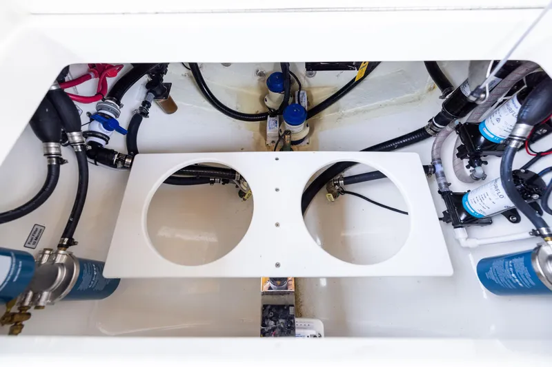 Slide: The Image of 2024 Regulator 34 boat engine compartment with hoses and filters. - 46